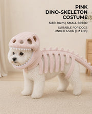 Small white dog wearing a pink dinosaur skeleton costume