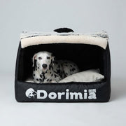 Front view of black enclosed dog house bed with Dalmatian